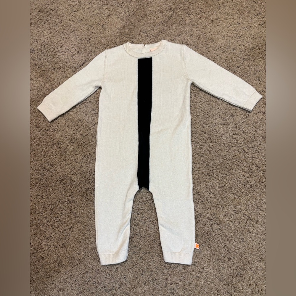 Tiny Cottons Cream and Black Knit Romper with snaps at legs, size 6-12 months.